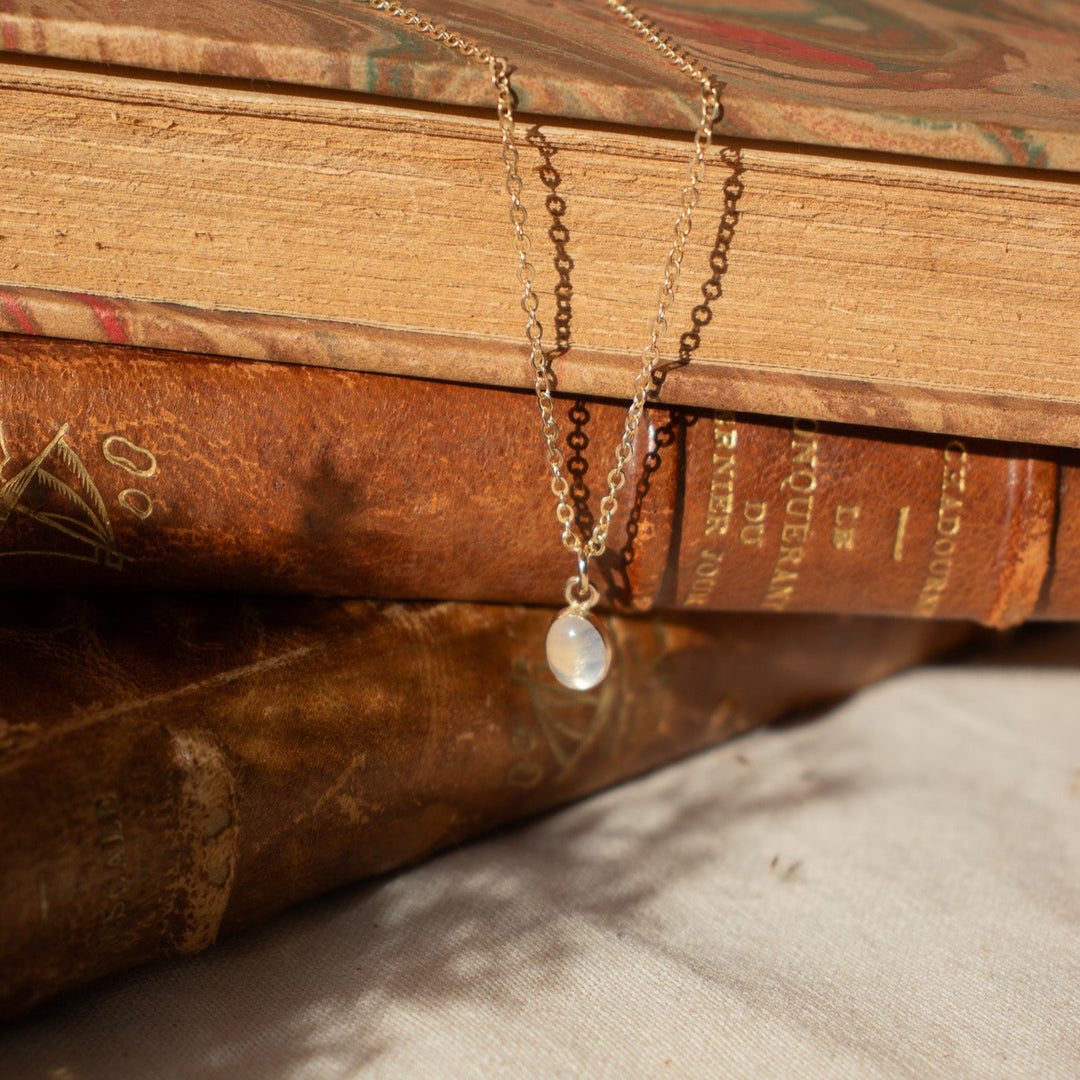 Necklace with a pendant on an old book