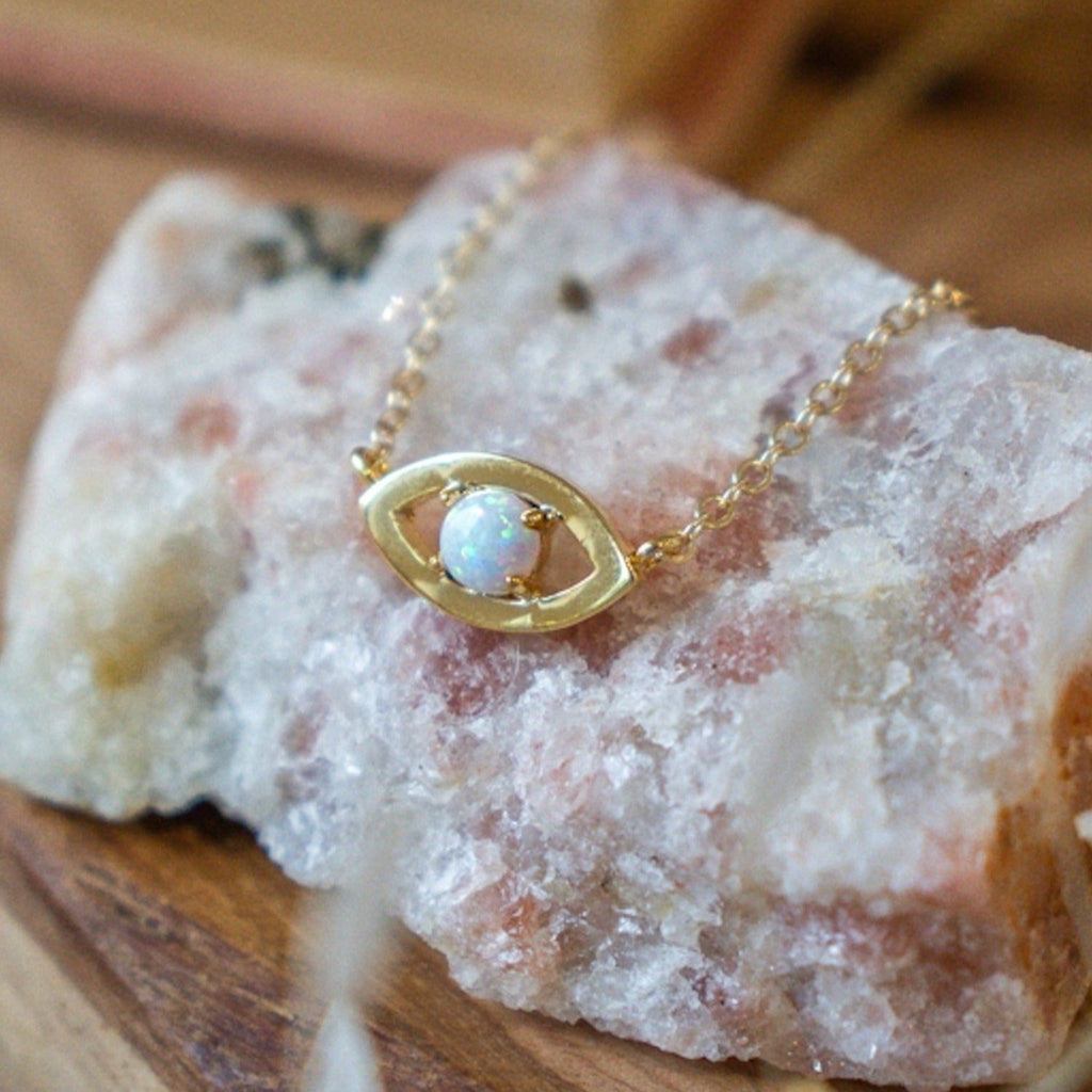 Dainty evil eye pendant with tiny synthetic opal. 