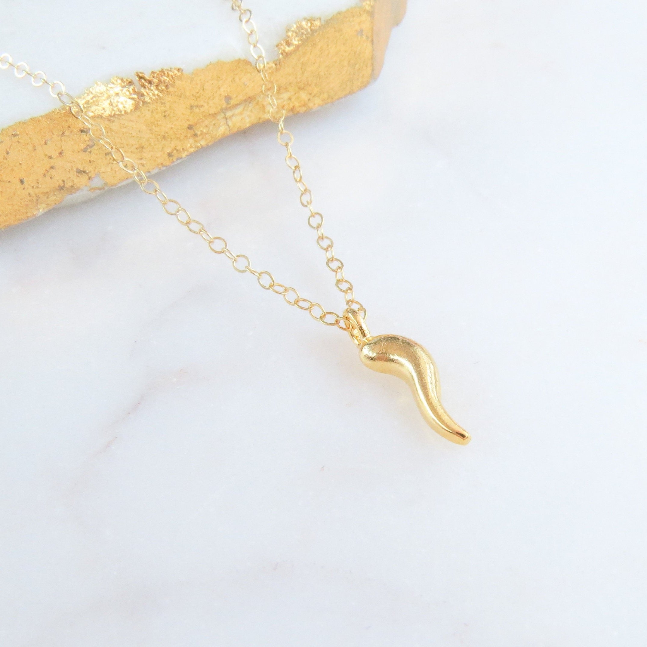 Gold horn pendant hotsell